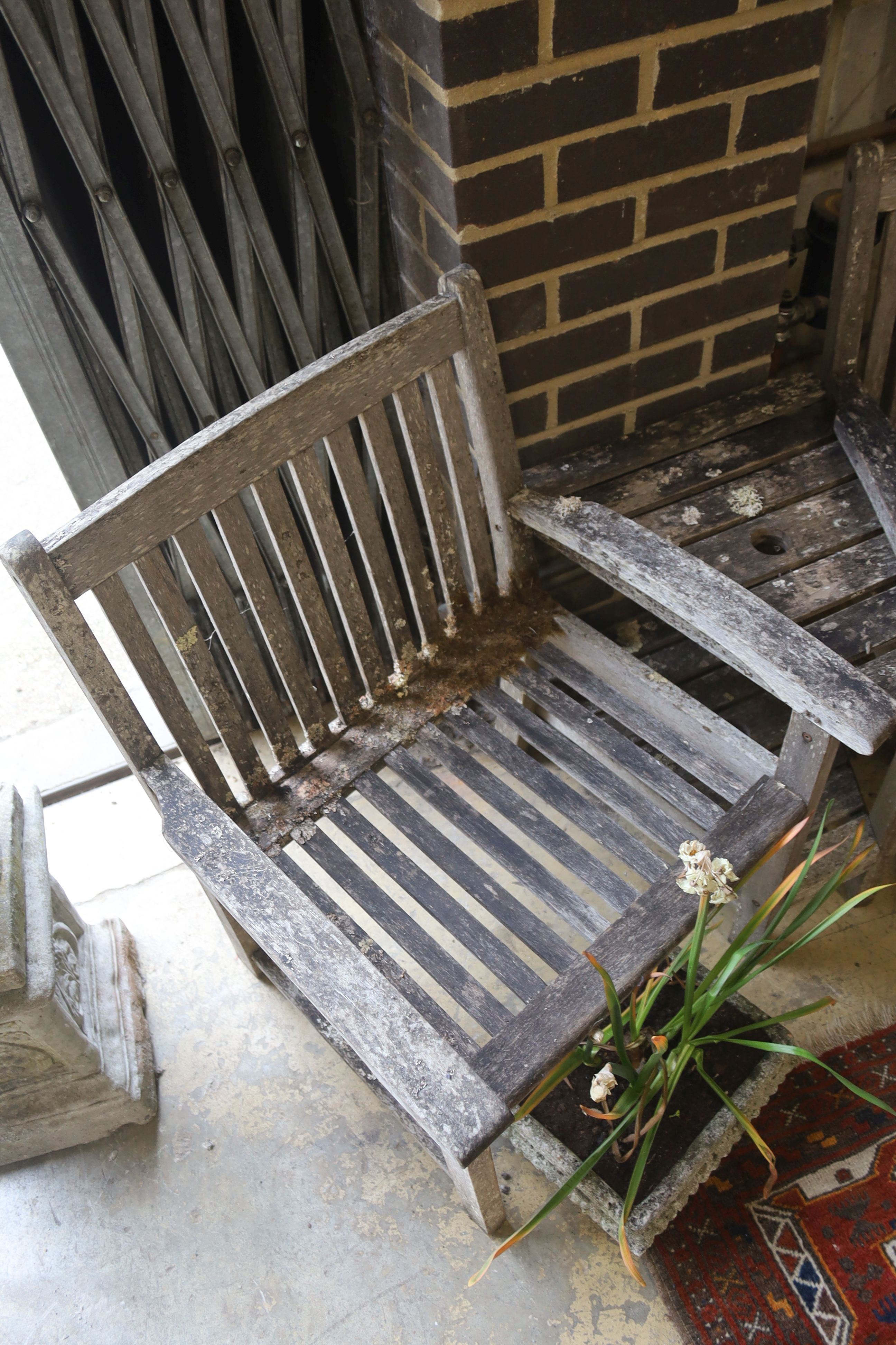 A weathered teak garden love seat, length 155cm, depth 70cm, height 88cm